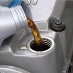 new oil being poured in after oil change